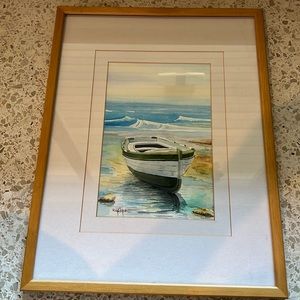 Original water color of boat on watery shore.  Double matted with wood frame.